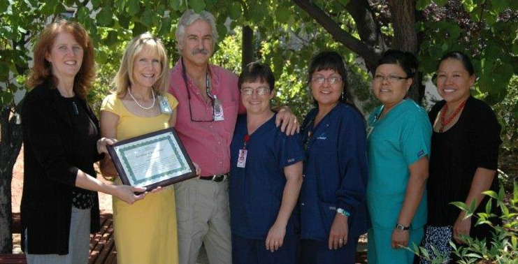 Jill Bullock of the Arizona Flex Program presents a CAH Recognition award to Page hospital staff