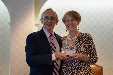 Tom Morris awarding the 2024 Calico Quality Leadership Award to Lisa Davis
