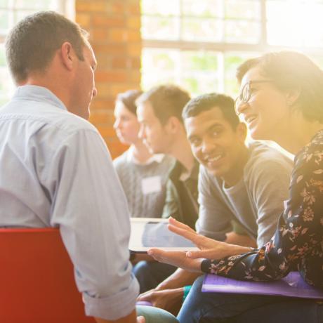 Diverse, small group of people in discussion